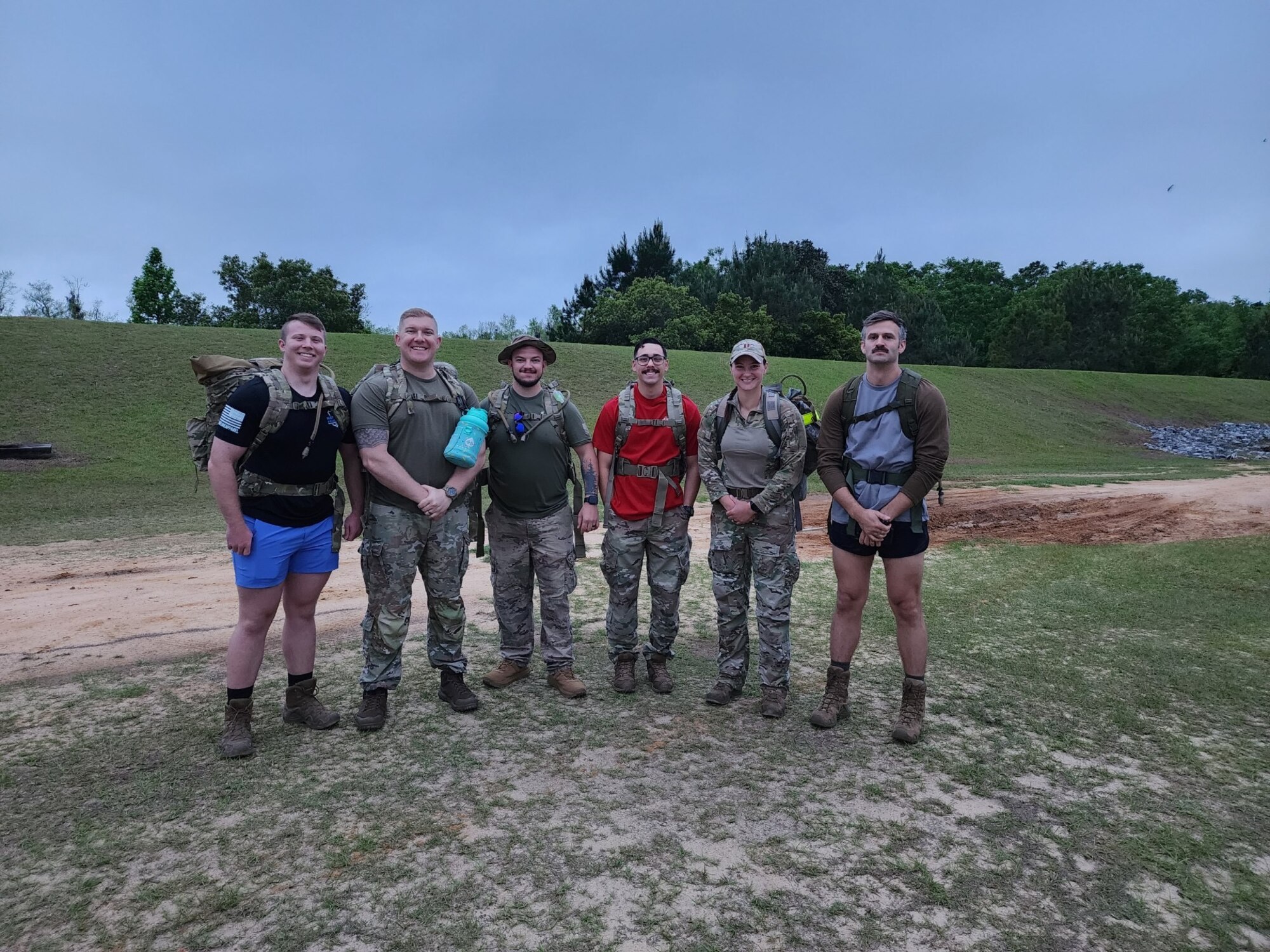 U.S. Air Force Airmen pose for a photo during an annual Bataan Death March in Lowndes County, Georgia, April 8, 2023. Approximately 76,000 Prisoners of War were forced to march 66 miles through prison camps. In honor of the Bataan Death March, Team Moody and local law enforcement came together with Valdosta Rotary Club to organize a memorial march. (U.S. Air Force courtesy photo)