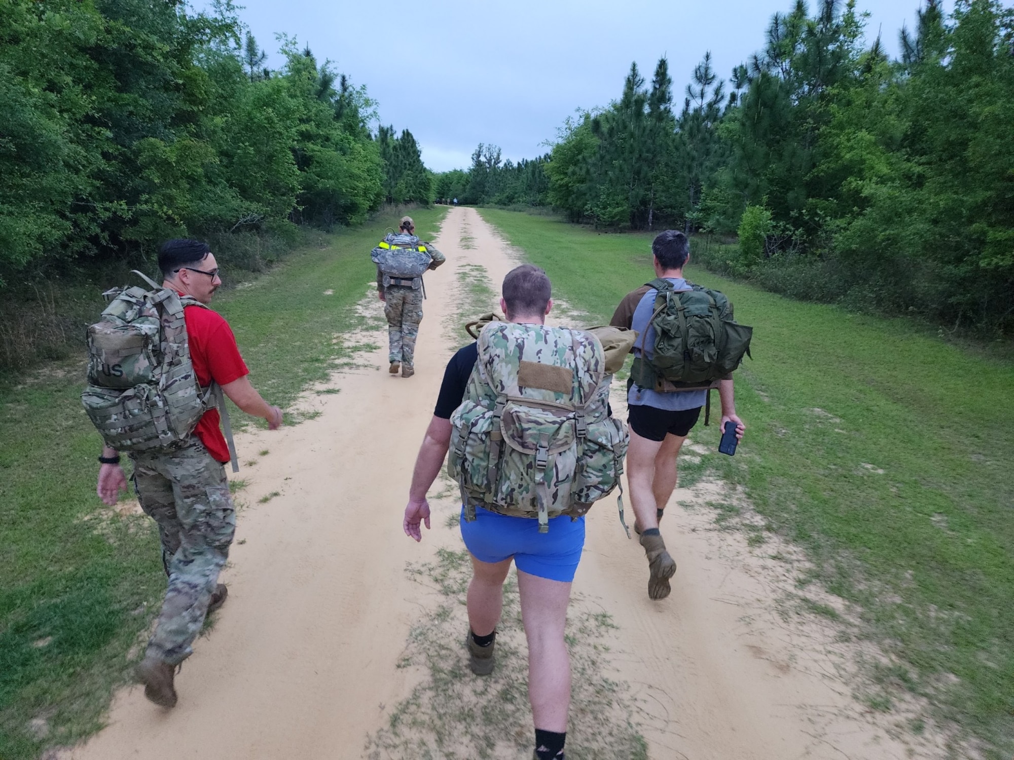 U.S. Air Force Airmen pose for a photo during an annual Bataan Death March in Lowndes County, Georgia, April 8, 2023. Approximately 76,000 Prisoners of War were forced to march 66 miles through prison camps. In honor of the Bataan Death March, Team Moody and local law enforcement came together with Valdosta Rotary Club to organize a memorial march. (U.S. Air Force courtesy photo)