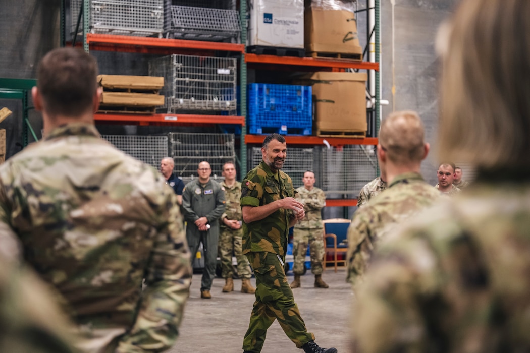 Airmen who completed the Norwegian Foot March receive their qualification pin from Maj. Arild Stangenes, Air Force Security Assistance Center Norwegian liaison officer, on April 7 at Wright-Patterson Air Force Base, Ohio.