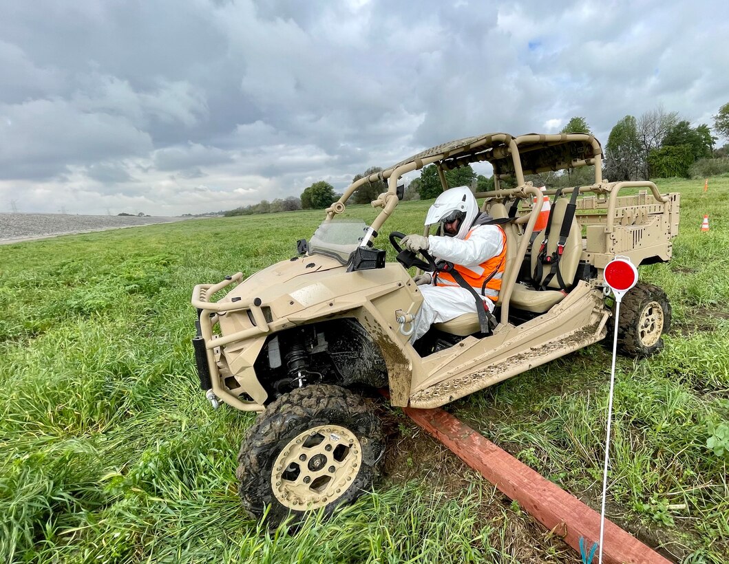 Alex Guzman, a member of the fence maintenance crew with the LA District’s Operations and Maintenance Branch, slowly drives a utility terrain vehicle over a wooden plank to demonstrate control during training March 23 at the Whittier Narrows Dam area of operations in Pico Rivera, California.