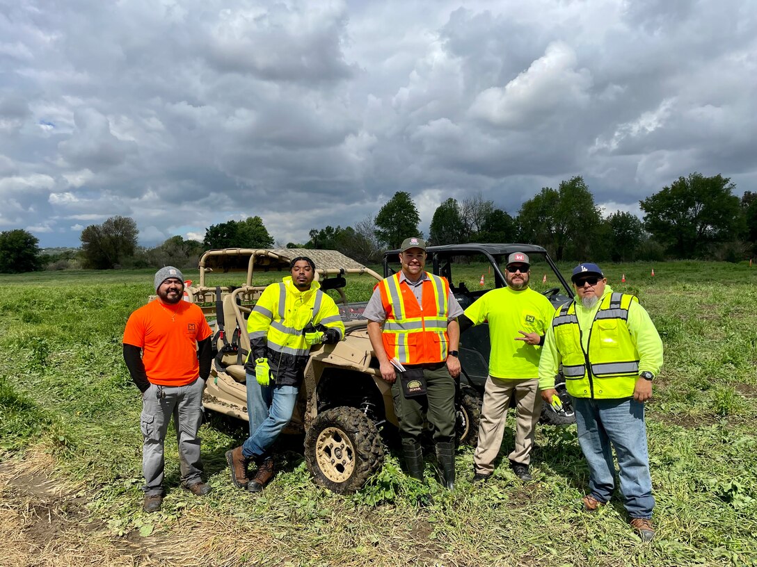 From left to right: Louie Chavez, Aaron Padin, Los Angeles District Park Ranger Nicolas Figueroa, Alex Guzman and Frank Gonzalez pose for a photo together after completing utility terrain vehicle training March 23 at the Whittier Narrows Dam area of operations in Pico Rivera, California. Chavez, Padin, Guzman and Gonzalez are members of the maintenance crew with the LA District’s Operations and Maintenance Branch.