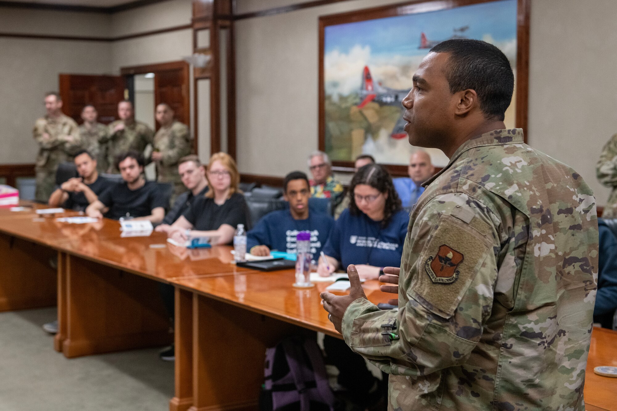U.S. Air Force Chief Master Sgt. Kodi Bailey, 333rd Training Squadron senior enlisted leader, welcomes Mississippi State University students during a tour of the 333rd TRS at Keesler Air Force Base, Mississippi, March 16, 2023.