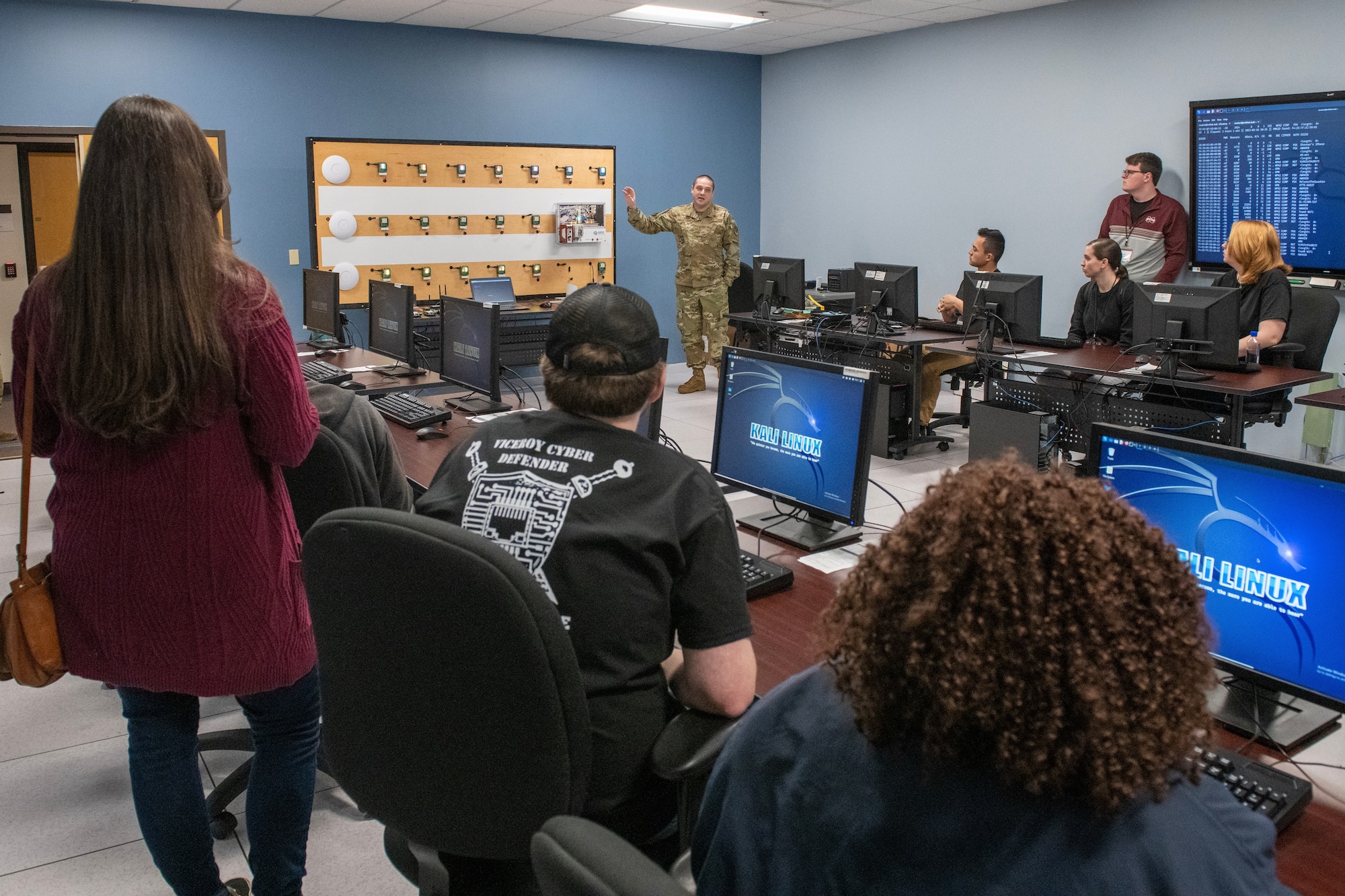 U.S. Air Force Tech. Sgt. Thomas Czerwinski, 333rd Training Squadron instructor, explains the tunneling lab at the 333rd TRS to Mississippi State University students visiting Keesler Air Force Base, Mississippi, March 16, 2023.