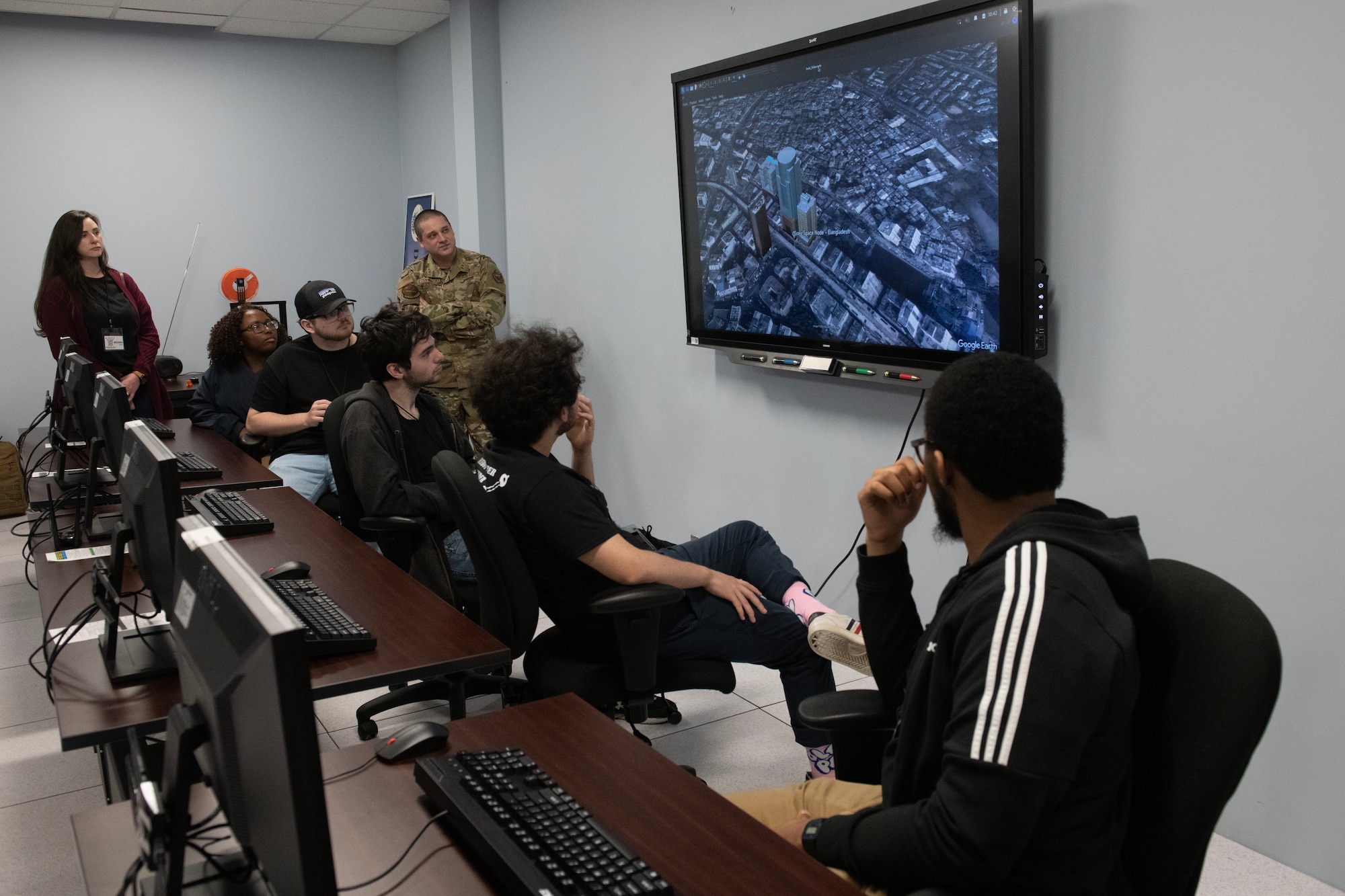 U.S. Air Force Tech. Sgt. Thomas Czerwinski, 333rd Training Squadron instructor, watches while Mississippi State University students explore the 333rd TRS’s tunneling lab equipment at Keesler Air Force Base, Mississippi, March 16, 2023.