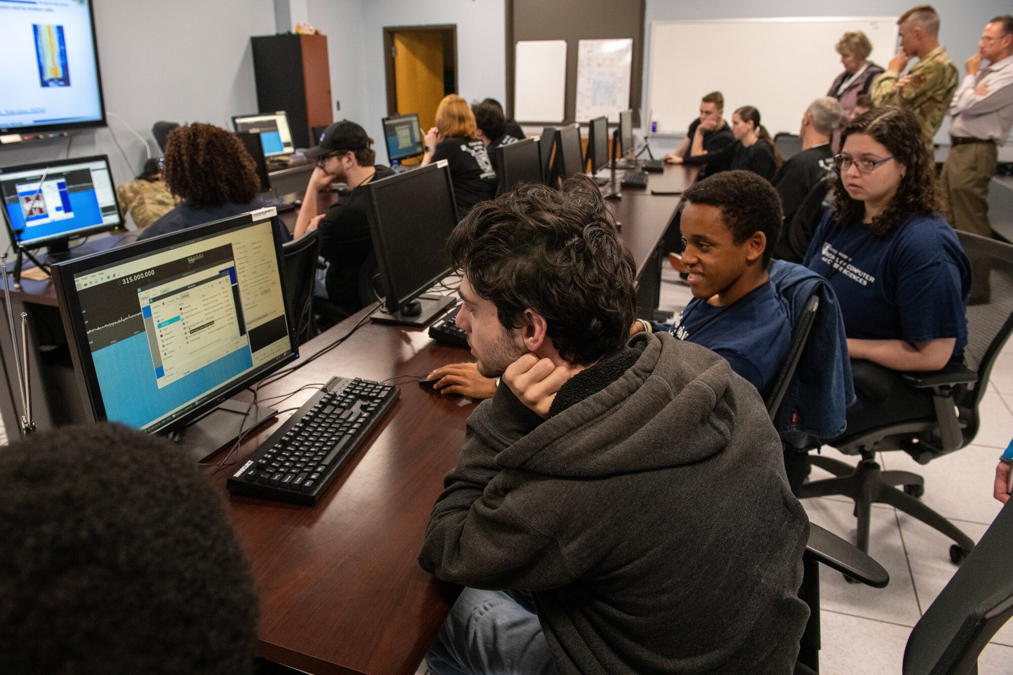 Mississippi State University students operate cyber equipment during a signals briefing at their visit to the 333rd Training Squadron on Keesler Air Force Base, Mississippi, March 16, 2023.