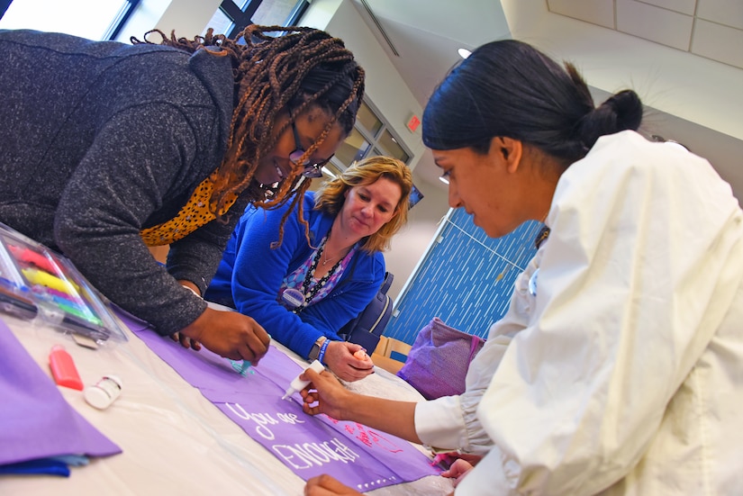 Civilian attendees decorate bandanas as part of the Clothesline of Healing event on Joint Base McGuire-Dix-Lakehurst, N.J., Apr. 12, 2023. The Clothesline of Healing is an event where members of the joint base community can decorate bandanas to show support for survivors and honor victims of interpersonal violence. April is Sexual Assault Awareness and Prevention Month. Joint Base MDL observes this month by raising awareness to prevent sexual assault and harassment and to provide resources and victim support to educate the public. These efforts contribute to a safe and secure joint base community. (U.S. Air Force photo by Daniel Barney)