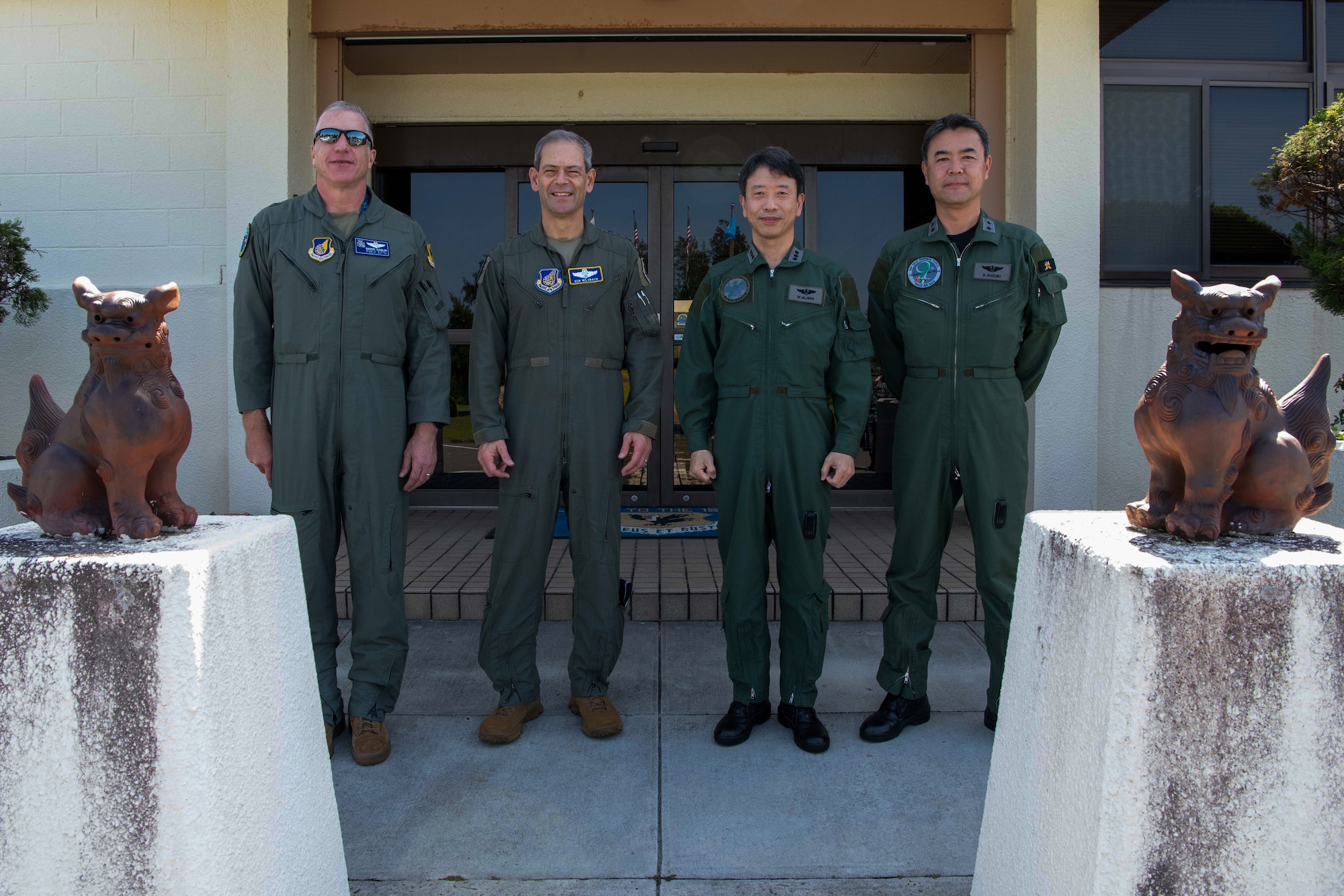 U.S. Air Force Brig. Gen. David Eaglin, 18th Wing commander, left, Gen. Ken Wilsbach, Pacific Air Forces commander, Japan Air Self-Defense Force Lt. Gen. Masahito Yajima, Southwestern Air Defense Force commander, and Japan Air Self-Defense Force Maj. Gen. Shigenao Suzuki, 9th Air Wing commander, pose for a photo at Kadena Air Base, Japan, April 16, 2023. Cooperation among Allies and partners is critical in deterring aggression and enhancing interoperability allowing our forces to counter military aggression by sharing responsibilities for common defense. (U.S. Air Force photo by Airman 1st Class Jonathan R. Sifuentes)