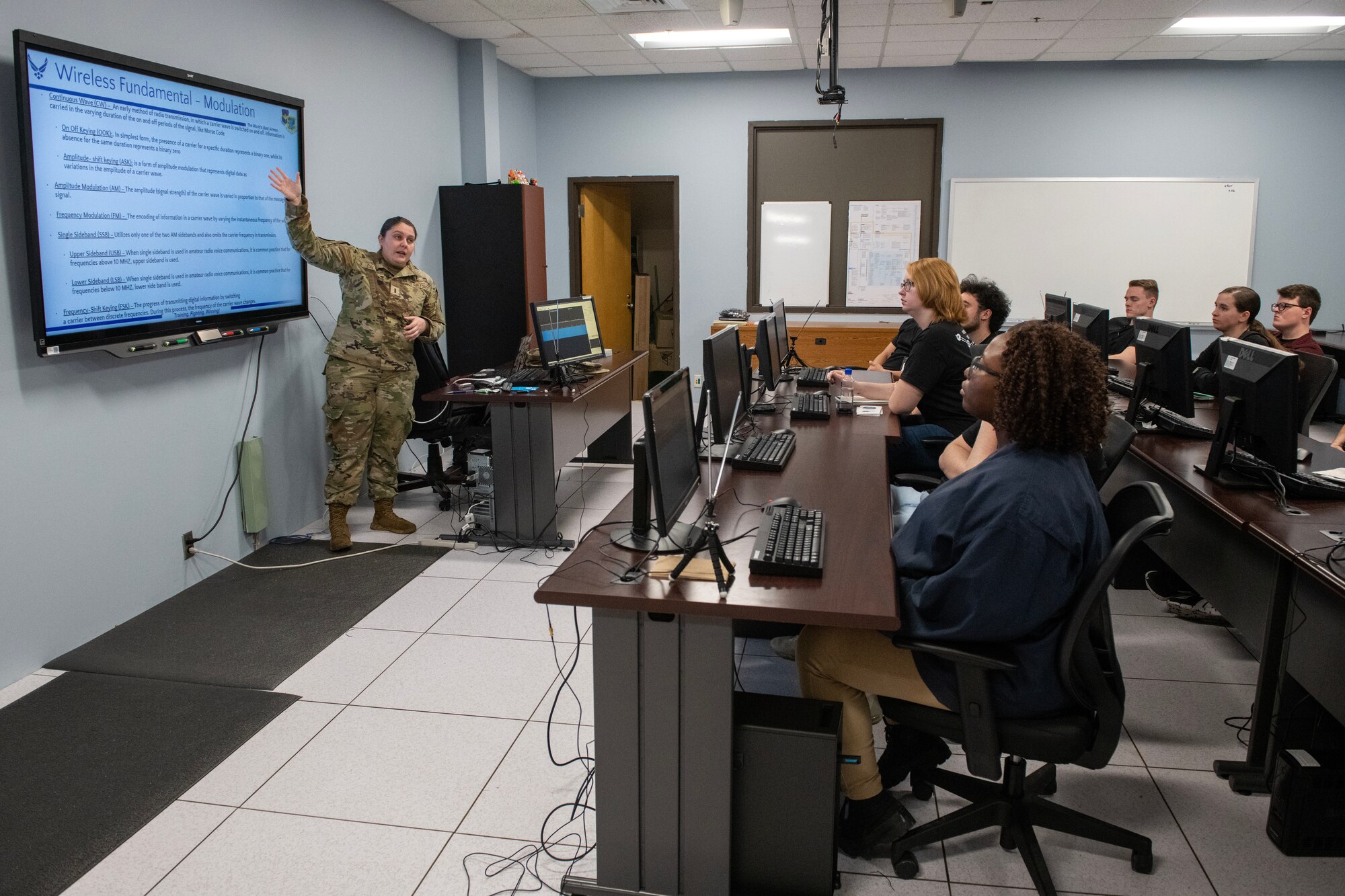 U.S. Air Force 2nd Lt. Jodi Dalton, 333rd Training Squadron instructor, leads a signals briefing for Mississippi State University students visiting the 333rd TRS on Keesler Air Force Base, Mississippi, March 16, 2023.