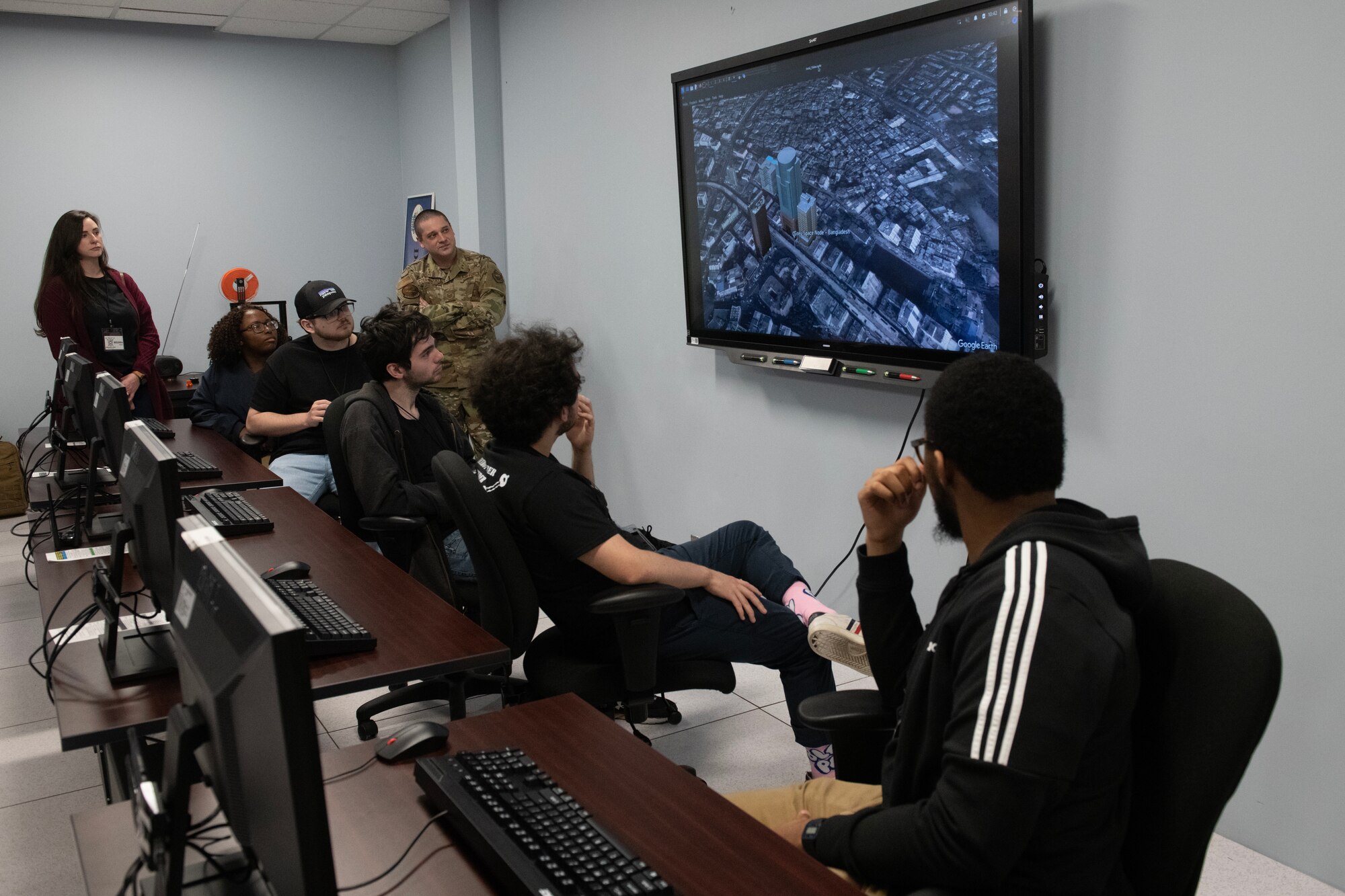 U.S. Air Force Tech. Sgt. Thomas Czerwinski, 333rd Training Squadron instructor, watches while Mississippi State University students explore the 333rd TRS’s tunneling lab equipment at Keesler Air Force Base, Mississippi, March 16, 2023.