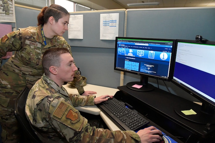 (Seated) Senior Airman Brandon Tankersley, and Airman 1st Class Jenna Skinner, both 75th Air Base Wing, information, and communications directorate, display a new electronic records management system, April 20, 2023, at Hill Air Force Base, Utah. (US Photo by Todd Cromar)