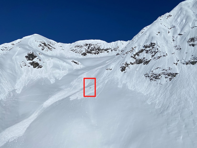 On April 19, 2023, an avalanche broke loose at the top of a mountain near Girdwood, Alaska, pulling a backcountry skier 800 to 1000 feet down the face. The red box indicates the injured skier and rescue team. The Alaska Army National Guard’s Golf Company, 2-211th General Aviation Support Battalion received mission request from the Alaska Rescue Coordination Center and rescued the skier with a hoist-capable HH-60M Black Hawk helicopter specially designed for medical evacuations.