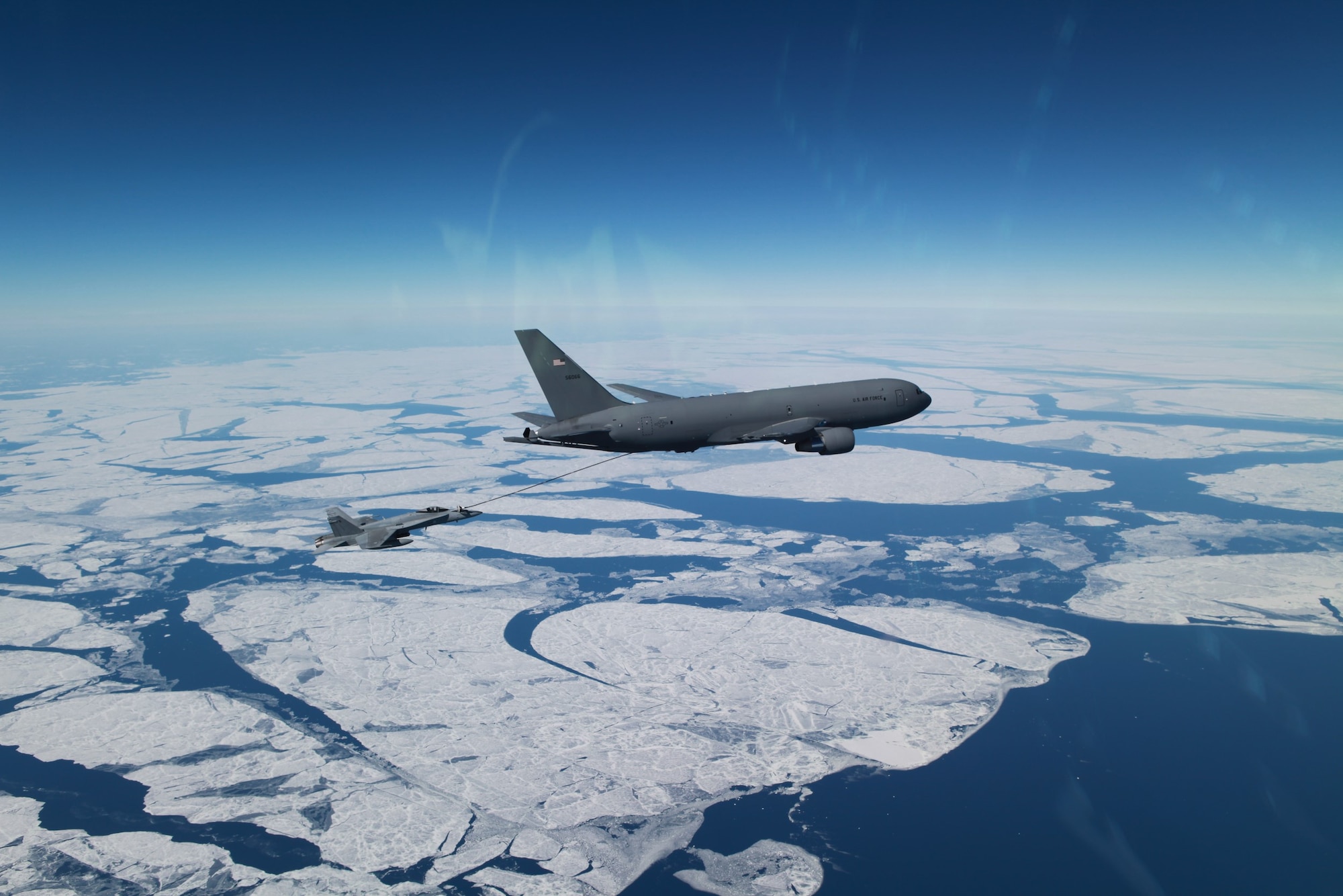 A U.S. KC-46A Pegasus tanker aircraft from the Air Force Reserve Command’s 931st Air Refueling Wing, primarily stationed at McConnell Air Force Base, Kansas, refuels Finnish F/A-18s, April 13, 2023.