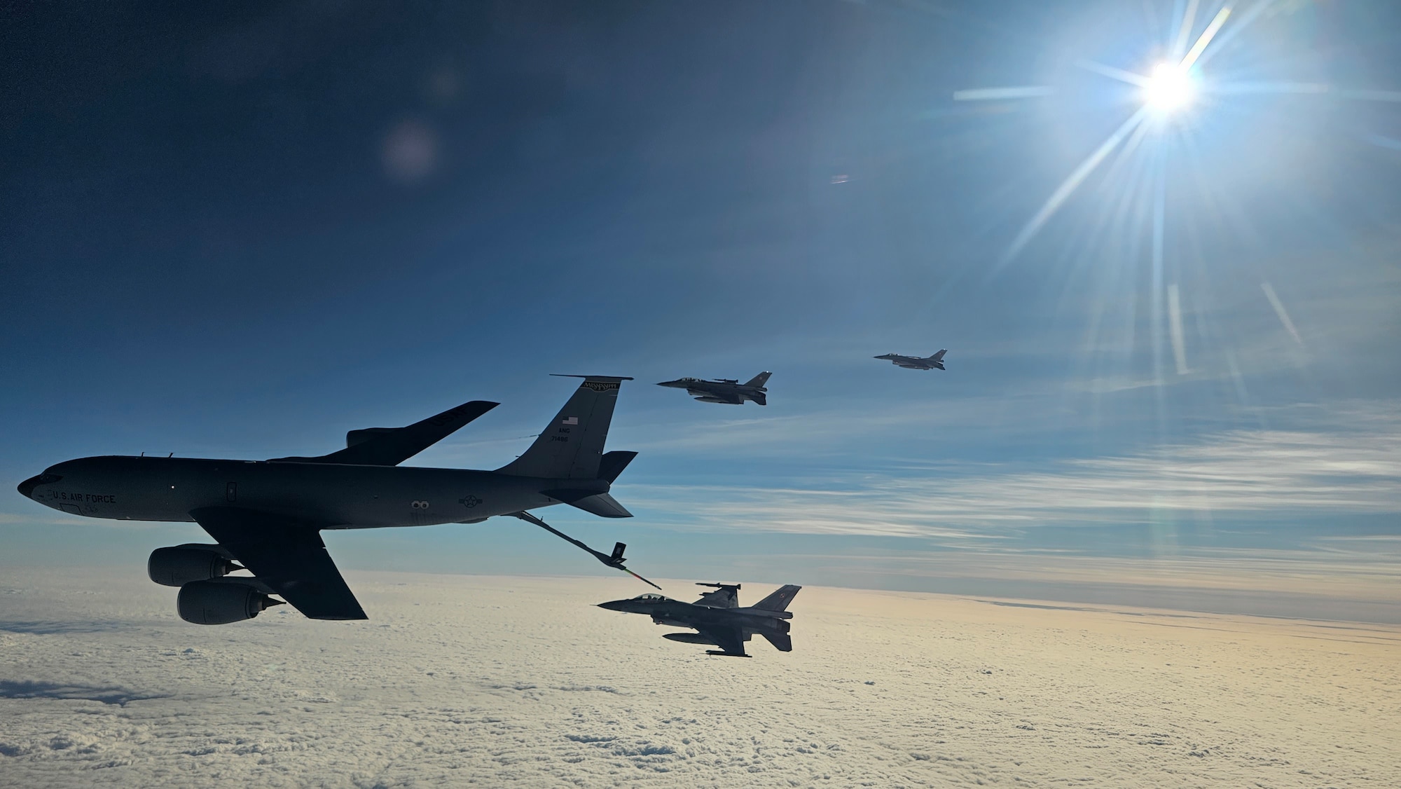A U.S. KC-135 Stratotanker from the 186th Air Refueling Wing, part of the Mississippi Air National Guard, refuels Polish F-16s from Powidz Air Base, Poland
