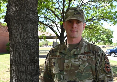U.S. Air Force Master Sgt. Chris Armstrong, 313th Training Squadron Flight Chief, stands outside at Goodfellow Air Force Base, Texas, April 10, 2023. Armstrong is pursuing a master’s in industrial and organizational psychology. (U.S. Air Force photo by Airman 1st Class Madison Collier)