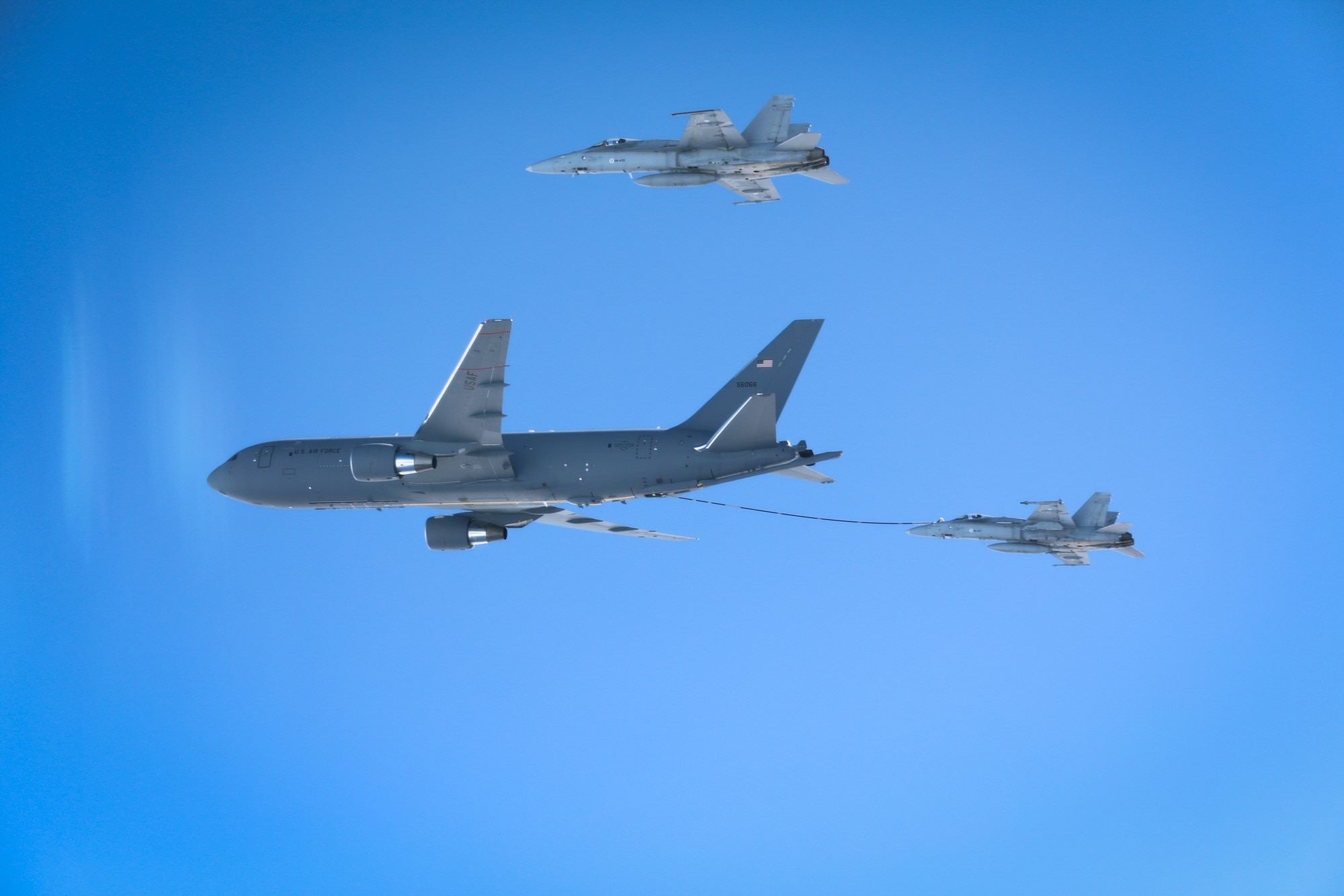 A U.S. KC-46A Pegasus tanker aircraft from the Air Force Reserve Command’s 931st Air Refueling Wing, primarily stationed at McConnell Air Force Base, Kansas, refuels Finnish F/A-18s, April 13, 2023.