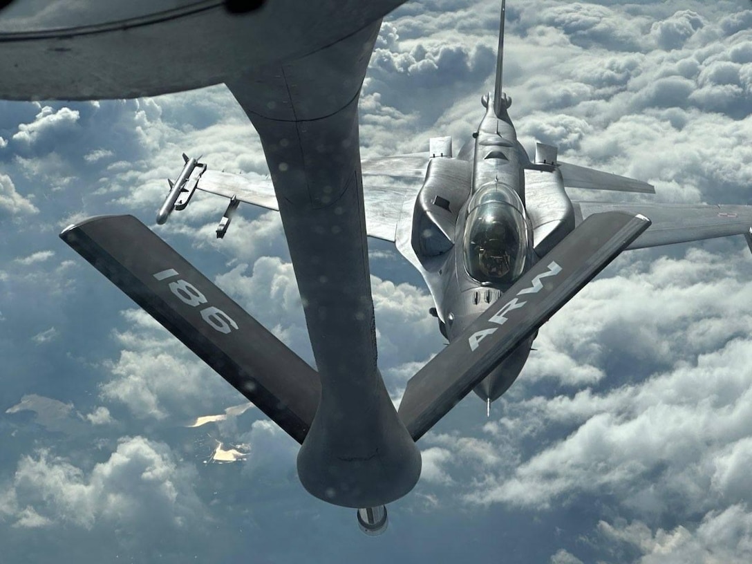 A U.S. KC-135 Stratotanker from the 186th Air Refueling Wing, part of the Mississippi Air National Guard, refuel Polish F-16s from Powidz Air Base, Poland, as part of the U.S. Air Force’s total force exercise, Copper Arrow.