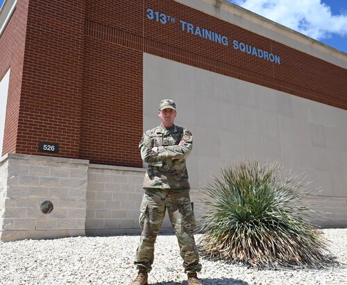 U.S. Air Force Master Sgt. Chris Armstrong, 313th Training Squadron Flight Chief, stands at Goodfellow Air Force Base, Texas, April 10, 2023. Armstrong oversees five different intel training courses, here. (U.S. Air Force photo by Airman 1st Class Madison Collier)