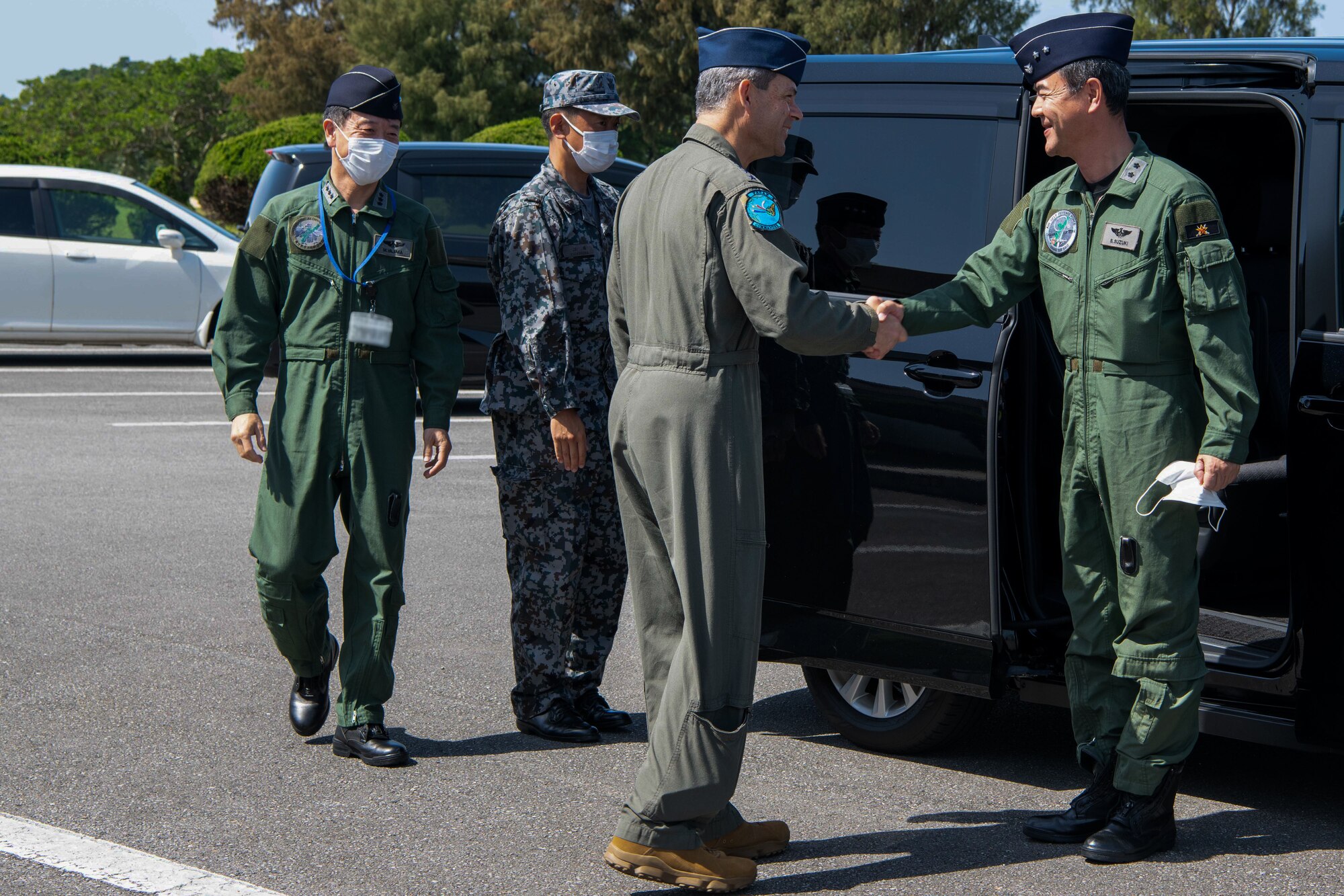 U.S. Air Force Gen. Ken Wilsbach, Pacific Air Forces commander, greets Japan Air Self-Defense Force Maj. Gen. Shigenao Suzuki, 9th Air Wing commander, at Kadena Air Base, Japan, April 16, 2023. Cooperation among Allies and partners is critical in deterring aggression and enhancing interoperability allowing our forces to counter military aggression by sharing responsibilities for common defense. (U.S. Air Force photo by Airman 1st Class Jonathan R. Sifuentes)