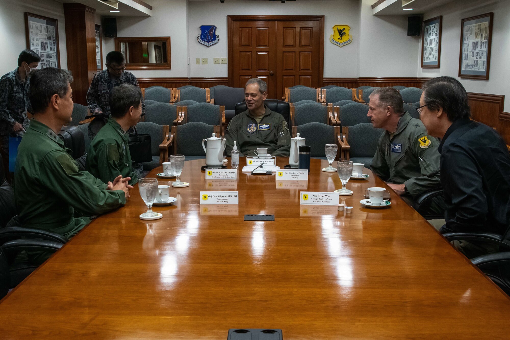 U.S. Air Force Gen. Ken Wilsbach, Pacific Air Forces commander, middle, speaks with leaders from the Japan Air Self-Defense Force about joint operations at Kadena Air Base, Japan, April 16, 2023. Cooperation among Allies and partners is critical in deterring aggression and enhancing interoperability allowing our forces to counter military aggression by sharing responsibilities for common defense. (U.S. Air Force photo by Airman 1st Class Jonathan R. Sifuentes)