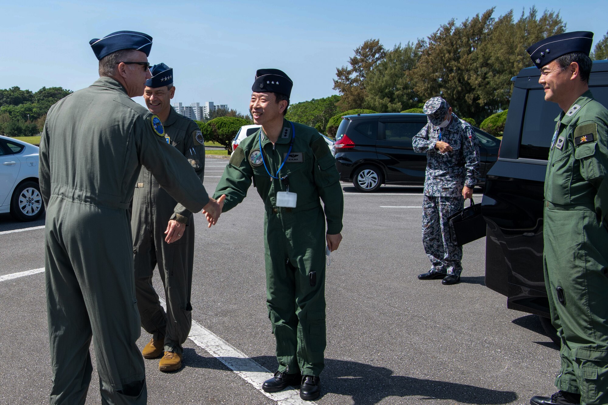 U.S. Air Force Brig. Gen. David Eaglin, 18th Wing commander, greets Japan Air Self-Defense Force Lt. Gen. Masahito Yajima, Southwestern Air Defense Force commander, at Kadena Air Base, Japan, April 16, 2023. Cooperation among Allies and partners is critical in deterring aggression and enhancing interoperability allowing our forces to counter military aggression by sharing responsibilities for common defense. (U.S. Air Force photo by Airman 1st Class Jonathan R. Sifuentes)