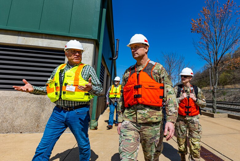 Rob Rich, a member of the Inland Waterways Users Board, talks to Maj. Gen. William Graham, deputy commanding general for Civil and Emergency Operations for the U.S. Army Corps of Engineers, during a tour of the Monongahela River Locks and Dam 4 at Charleroi, Pennsylvania, April 12, 2023.

The U.S. Army Corps of Engineers Pittsburgh District hosted the tour and several briefings about ongoing and future inland navigation construction projects within the district.

During the tour, Inland Waterways User Board (IWUB) members learned about the overall Lower Monongahela River navigation project and the new river chamber construction at Charleroi, which is in its final phase after nearly 20 years of construction. Members also listened to briefings about the overall Upper Ohio navigation project and its first major construction contract, the new Montgomery lock construction. 

IWUB is an industry federal-advisory committee representing all fuel-taxed inland waterway systems within the United States. The navigation industry contributes to the Inland Waterways Trust Fund through fuel taxes paid by carriers who transport bulk commodities on the inland waterway system. The board makes recommendations to Congress and the Assistant Secretary of the Army for Civil Works on how best to invest federal and trust funds dollars to keep the most cost-effective, environmentally friendly, and safest form of transportation for bulk commodities resilient and reliable.
(U.S. Army Corps of Engineers Pittsburgh District photo by Michel Sauret)