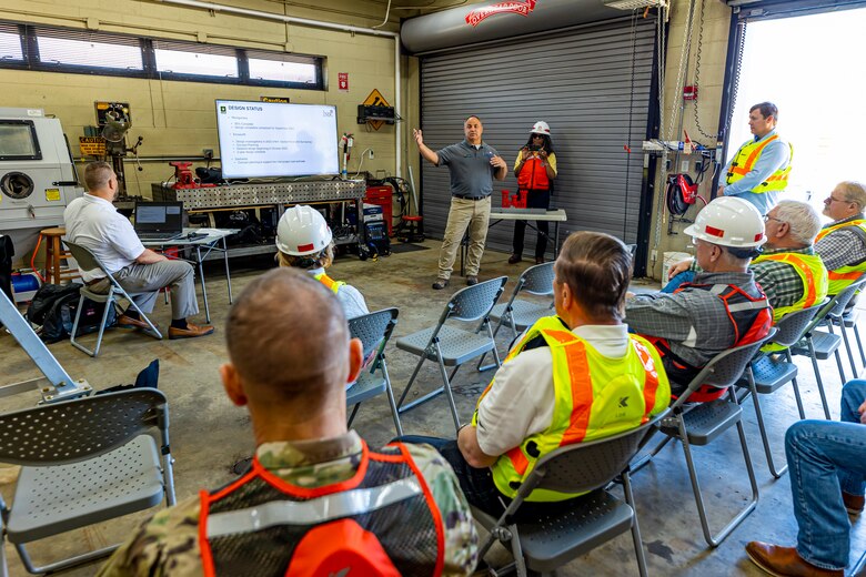 Cory Morgan, the Upper Ohio project lead engineer with the Inland Navigation Design Center, briefs members of the Inland Waterways Users Board while on a tour of the Monongahela River Locks and Dam 4 at Charleroi, Pennsylvania, April 12, 2023.

During the tour, Inland Waterways User Board (IWUB) members learned about the overall Lower Monongahela River navigation project and the new river chamber construction at Charleroi, which is in its final phase after nearly 20 years of construction. Members also listened to briefings about the overall Upper Ohio navigation project and its first major construction contract, the new Montgomery lock construction. 

IWUB is an industry federal-advisory committee representing all fuel-taxed inland waterway systems within the United States. The navigation industry contributes to the Inland Waterways Trust Fund through fuel taxes paid by carriers who transport bulk commodities on the inland waterway system. The board makes recommendations to Congress and the Assistant Secretary of the Army for Civil Works on how best to invest federal and trust funds dollars to keep the most cost-effective, environmentally friendly, and safest form of transportation for bulk commodities resilient and reliable.
(U.S. Army Corps of Engineers Pittsburgh District photo by Michel Sauret)