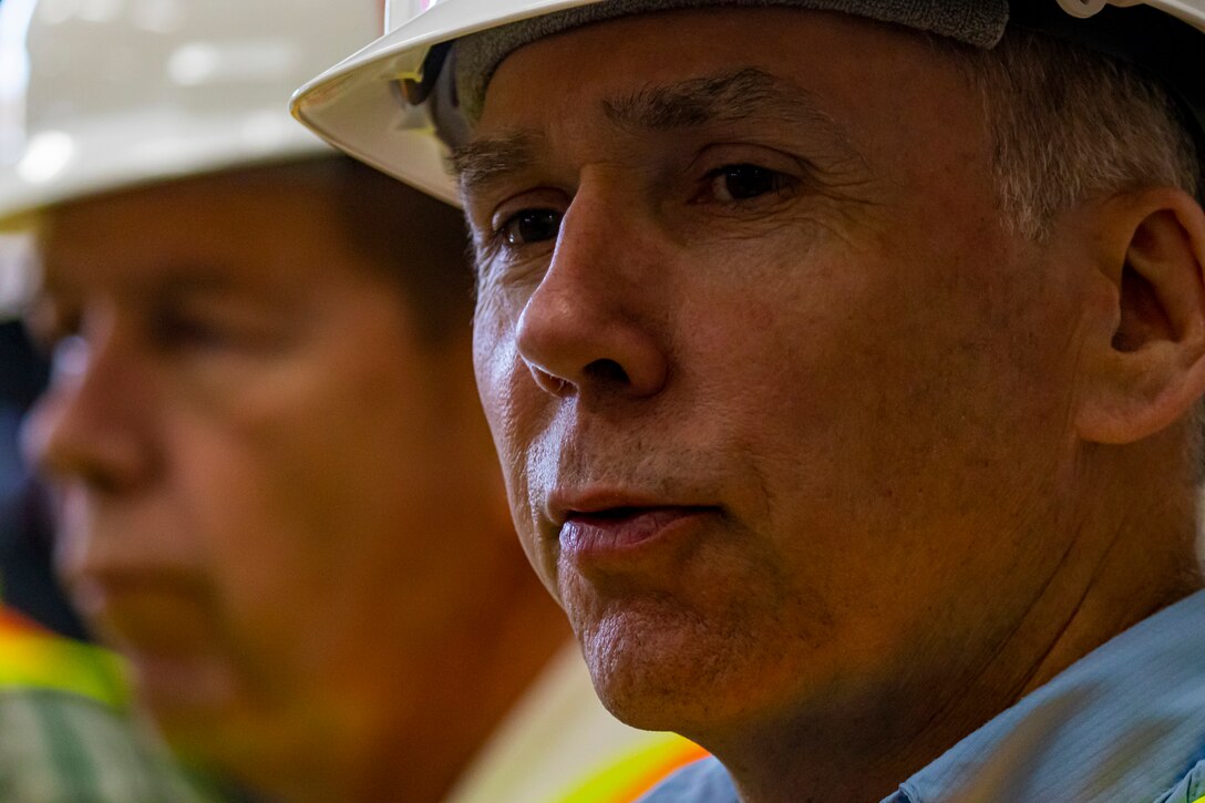 Thomas P. Smith, with the U.S. Army Corps of Engineers, talks with members of the Inland Waterways Users Board during a tour of the Monongahela River Locks and Dam 4 at Charleroi, Pennsylvania, April 12, 2023.

The U.S. Army Corps of Engineers Pittsburgh District hosted the tour and several briefings about ongoing and future inland navigation construction projects within the district.

During the tour, Inland Waterways User Board (IWUB) members learned about the overall Lower Monongahela River navigation project and the new river chamber construction at Charleroi, which is in its final phase after nearly 20 years of construction. Members also listened to briefings about the overall Upper Ohio navigation project and its first major construction contract, the new Montgomery lock construction. 

IWUB is an industry federal-advisory committee representing all fuel-taxed inland waterway systems within the United States. The navigation industry contributes to the Inland Waterways Trust Fund through fuel taxes paid by carriers who transport bulk commodities on the inland waterway system. The board makes recommendations to Congress and the Assistant Secretary of the Army for Civil Works on how best to invest federal and trust funds dollars to keep the most cost-effective, environmentally friendly, and safest form of transportation for bulk commodities resilient and reliable.
(U.S. Army Corps of Engineers Pittsburgh District photo by Michel Sauret)