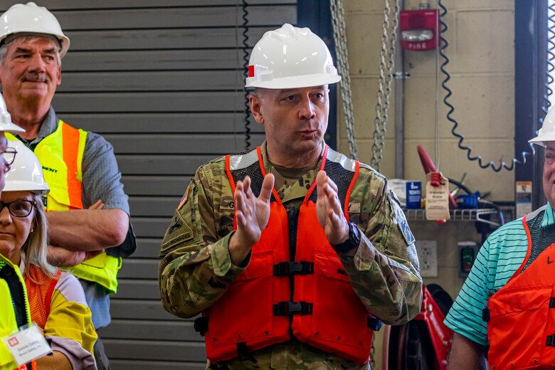 Maj. Gen. William Graham, deputy commanding general for Civil and Emergency Operations for the U.S. Army Corps of Engineers, talks with members of the Inland Waterways Users Board during a tour of the Monongahela River Locks and Dam 4 at Charleroi, Pennsylvania, April 12, 2023.

The U.S. Army Corps of Engineers Pittsburgh District hosted the tour and several briefings about ongoing and future inland navigation construction projects within the district.

During the tour, Inland Waterways User Board (IWUB) members learned about the overall Lower Monongahela River navigation project and the new river chamber construction at Charleroi, which is in its final phase after nearly 20 years of construction. Members also listened to briefings about the overall Upper Ohio navigation project and its first major construction contract, the new Montgomery lock construction. 

IWUB is an industry federal-advisory committee representing all fuel-taxed inland waterway systems within the United States. The navigation industry contributes to the Inland Waterways Trust Fund through fuel taxes paid by carriers who transport bulk commodities on the inland waterway system. The board makes recommendations to Congress and the Assistant Secretary of the Army for Civil Works on how best to invest federal and trust funds dollars to keep the most cost-effective, environmentally friendly, and safest form of transportation for bulk commodities resilient and reliable.
(U.S. Army Corps of Engineers Pittsburgh District photo by Michel Sauret)
