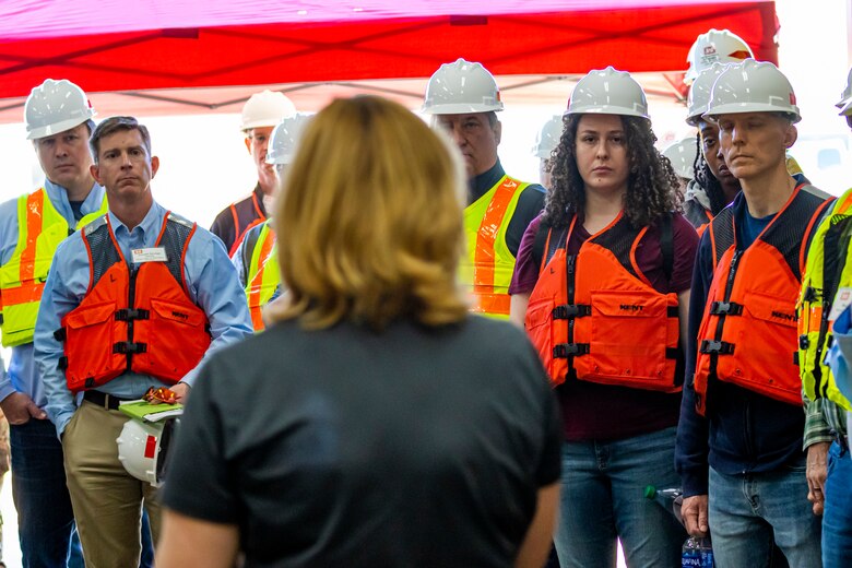Beth Schneller, technical support branch chief for the U.S. Army Corps of Engineers Pittsburgh District, gives opening remarks to members of the Inland Waterways Users Board to start a tour of the Monongahela River Locks and Dam 4 at Charleroi, Pennsylvania, April 12, 2023.

The U.S. Army Corps of Engineers Pittsburgh District hosted the tour and several briefings about ongoing and future inland navigation construction projects within the district.

During the tour, Inland Waterways User Board (IWUB) members learned about the overall Lower Monongahela River navigation project and the new river chamber construction at Charleroi, which is in its final phase after nearly 20 years of construction. Members also listened to briefings about the overall Upper Ohio navigation project and its first major construction contract, the new Montgomery lock construction. 

IWUB is an industry federal-advisory committee representing all fuel-taxed inland waterway systems within the United States. The navigation industry contributes to the Inland Waterways Trust Fund through fuel taxes paid by carriers who transport bulk commodities on the inland waterway system. The board makes recommendations to Congress and the Assistant Secretary of the Army for Civil Works on how best to invest federal and trust funds dollars to keep the most cost-effective, environmentally friendly, and safest form of transportation for bulk commodities resilient and reliable.
(U.S. Army Corps of Engineers Pittsburgh District photo by Michel Sauret)