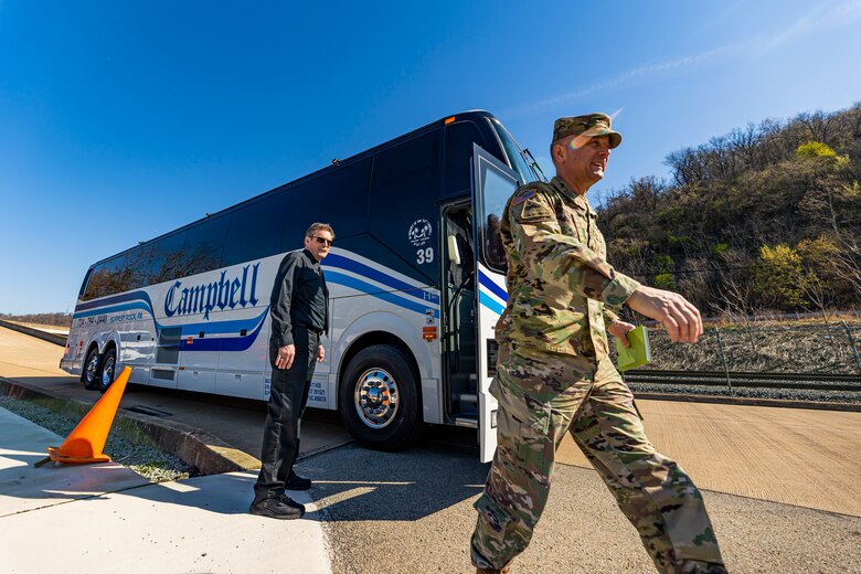 Maj. Gen. William Graham, deputy commanding general for Civil and Emergency Operations for the U.S. Army Corps of Engineers, steps off the bus with members of the Inland Waterways Users Board for a tour of the Monongahela River Locks and Dam 4 at Charleroi, Pennsylvania, April 12, 2023.

The U.S. Army Corps of Engineers Pittsburgh District hosted the tour and several briefings about ongoing and future inland navigation construction projects within the district.

During the tour, Inland Waterways User Board (IWUB) members learned about the overall Lower Monongahela River navigation project and the new river chamber construction at Charleroi, which is in its final phase after nearly 20 years of construction. Members also listened to briefings about the overall Upper Ohio navigation project and its first major construction contract, the new Montgomery lock construction. 

IWUB is an industry federal-advisory committee representing all fuel-taxed inland waterway systems within the United States. The navigation industry contributes to the Inland Waterways Trust Fund through fuel taxes paid by carriers who transport bulk commodities on the inland waterway system. The board makes recommendations to Congress and the Assistant Secretary of the Army for Civil Works on how best to invest federal and trust funds dollars to keep the most cost-effective, environmentally friendly, and safest form of transportation for bulk commodities resilient and reliable.
(U.S. Army Corps of Engineers Pittsburgh District photo by Michel Sauret)