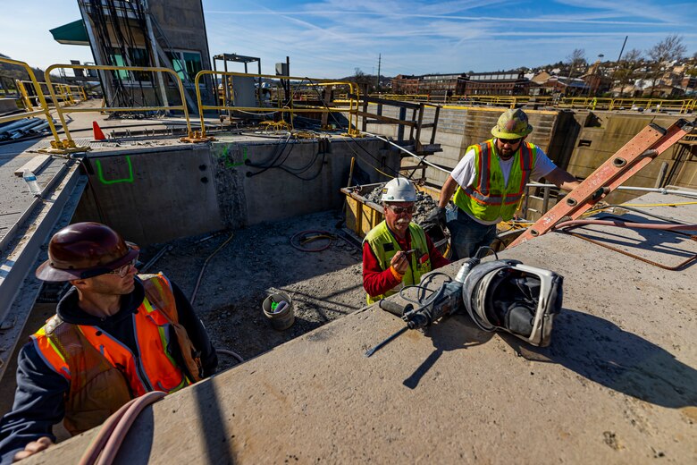Construction workers put on the finishing touches on the new river chamber being built at the Monongahela River Locks and Dam 4 in Charleroi, Pennsylvania, April 12, 2023.

The U.S. Army Corps of Engineers Pittsburgh District hosted the tour and several briefings about ongoing and future inland navigation construction projects within the district.

During the tour, Inland Waterways User Board (IWUB) members learned about the overall Lower Monongahela River navigation project and the new river chamber construction at Charleroi, which is in its final phase after nearly 20 years of construction. Members also listened to briefings about the overall Upper Ohio navigation project and its first major construction contract, the new Montgomery lock construction. 

IWUB is an industry federal-advisory committee representing all fuel-taxed inland waterway systems within the United States. The navigation industry contributes to the Inland Waterways Trust Fund through fuel taxes paid by carriers who transport bulk commodities on the inland waterway system. The board makes recommendations to Congress and the Assistant Secretary of the Army for Civil Works on how best to invest federal and trust funds dollars to keep the most cost-effective, environmentally friendly, and safest form of transportation for bulk commodities resilient and reliable.
(U.S. Army Corps of Engineers Pittsburgh District photo by Michel Sauret)