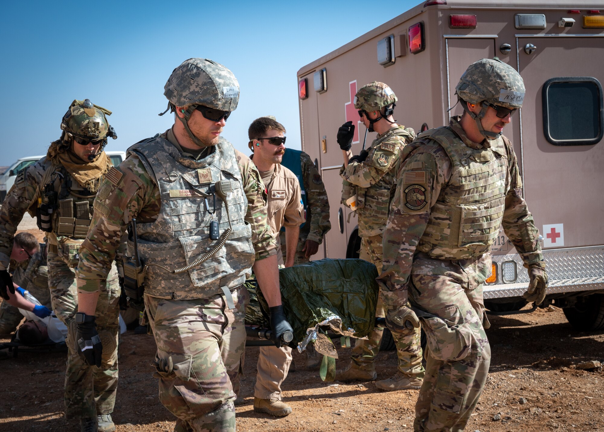 A Pararescue Specialist with the 52nd Expeditionary Rescue Squadron inserts an IV catheter into a simulated injured patient while inside an HH-60G Pave Hawk helicopter at an undisclosed location in Southwest Asia, March 13, 2023.