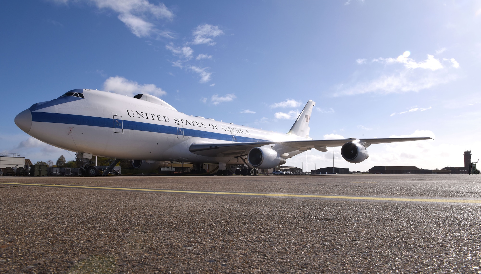 An E-4B National Airborne Operations Center stands ready at Royal Air Force Mildenhall, England, April 12, 2023. The NAOC aircraft has several missions, both operational and training, which require travel to a wide variety of locations, both within the United States and around the world. (U.S. Force photo by Karen Abeyasekere/This image has been altered for security purposes).