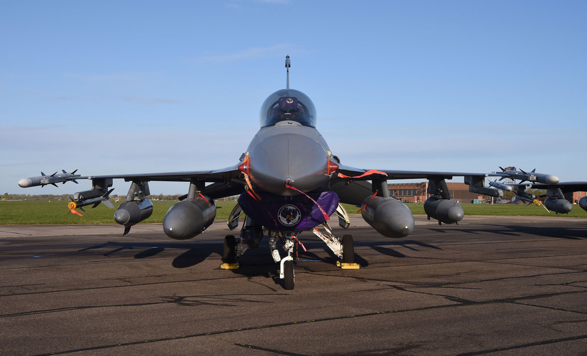 A U.S. Air Force F-16CM Fighting Falcon from the 510th Fighter Squadron, Aviano Air Base, Italy, sits on the flightline before being prepped for takeoff at Royal Air Force Mildenhall, England, April 12, 2023. The 510th FS, known as “Buzzards,” provides combat airpower on demand to U.S. and NATO combatant commanders, as well as the National Command Authority in order to meet National Security objectives. The unit performs air and space control and force application roles of counter-air, strategic attack, and counter-land including interdiction and close-air support. (U.S. Air Force photo by Karen Abeyasekere)