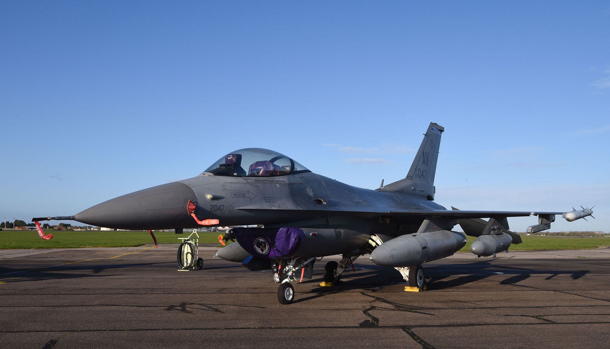 A U.S. Air Force F-16CM Fighting Falcon from the 510th Fighter Squadron, Aviano Air Base, Italy, sits on the flightline before being prepped for takeoff at Royal Air Force Mildenhall, England, April 12, 2023. The 510th FS, known as “Buzzards,” provides combat airpower on demand to U.S. and NATO combatant commanders, as well as the National Command Authority in order to meet National Security objectives. The unit performs air and space control and force application roles of counter-air, strategic attack, and counter-land including interdiction and close-air support. (U.S. Air Force photo by Karen Abeyasekere)