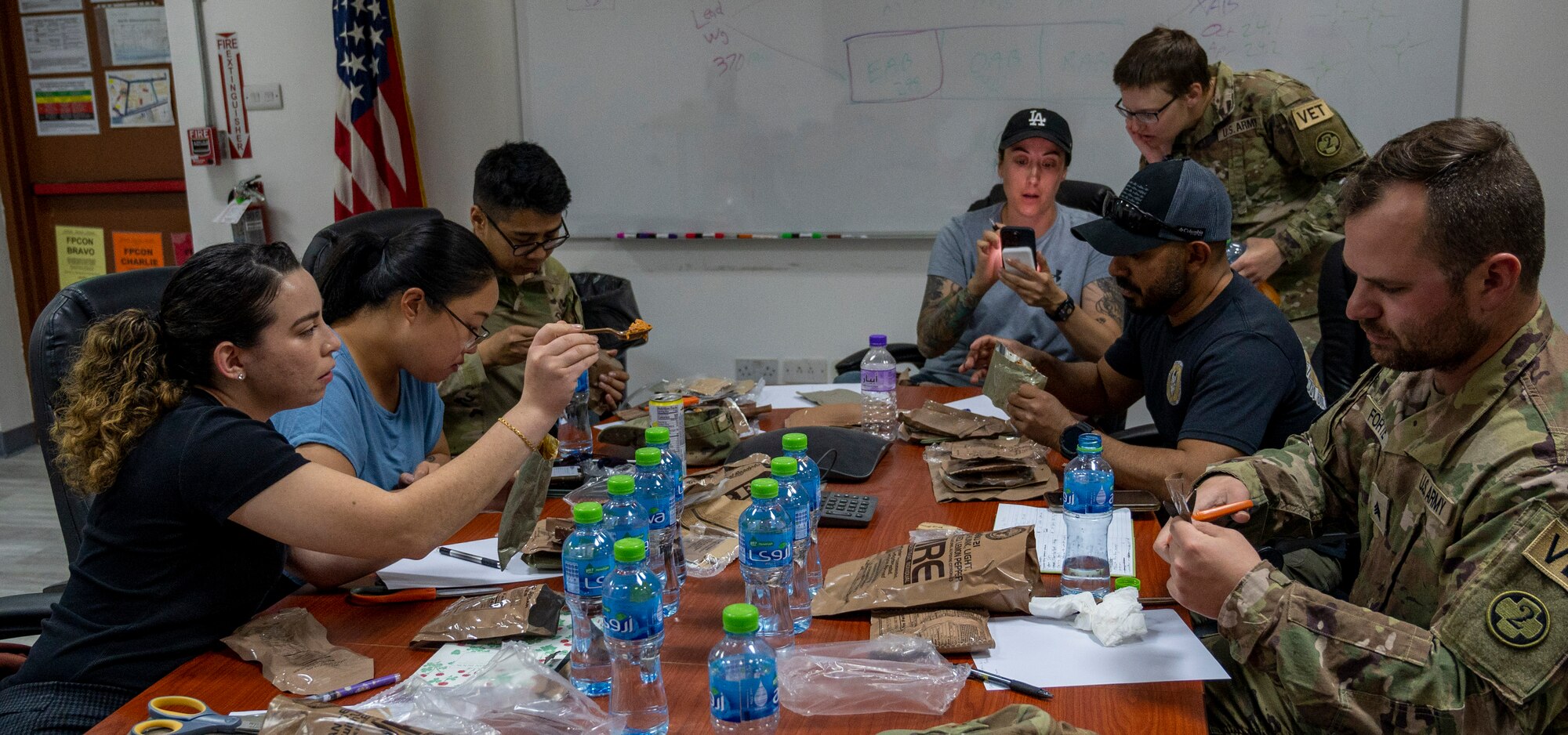 U.S. Air Force Airmen from the 386th Expeditionary Medical Squadron food inspection team and U.S. Army Soldiers from the 109th Medical Detachment Veteran Support Squadron test Meals Ready to Eat for quality and freshness at Ali Al Salem Air Base, Kuwait, April 5, 2023.