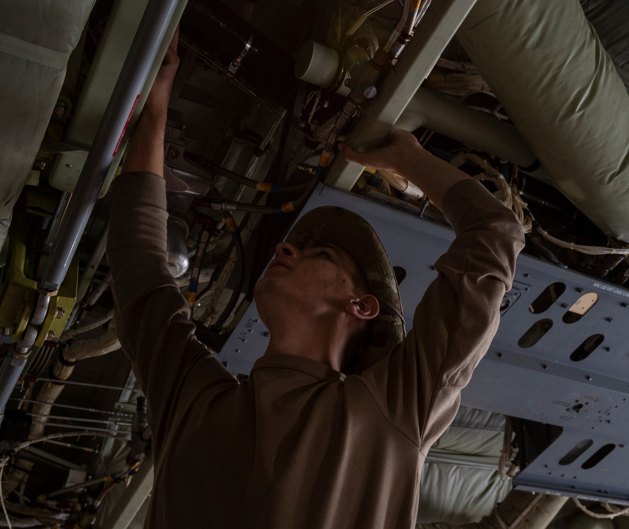 U.S. Air Force Senior Airman Tyler Horschel, a 386th Expeditionary Aircraft Maintenance Squadron crew chief, cleans hydraulic fluids from a hydraulic boost pack at Ali Al Salem Air Base, Kuwait, March 22, 2023.