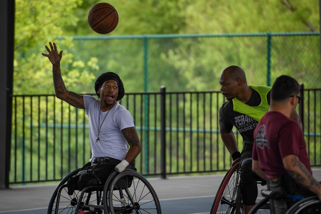 Athletes take part in a wheelchair basketball practice.