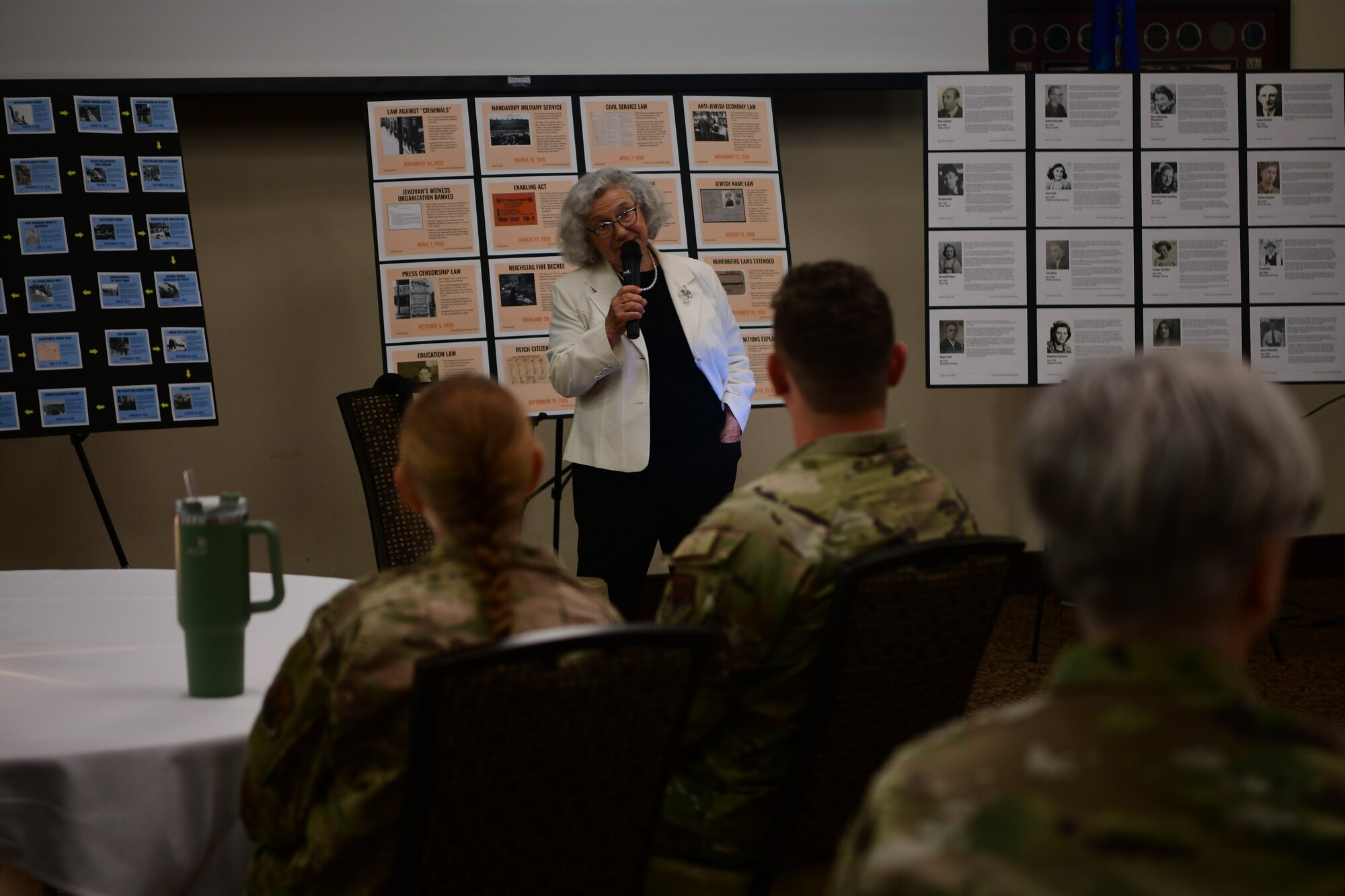 Elizabeth Igra, retired veteran educator, gives a speech at the Recce Point Club on Beale Air Force Base, California, on April 18, 2023