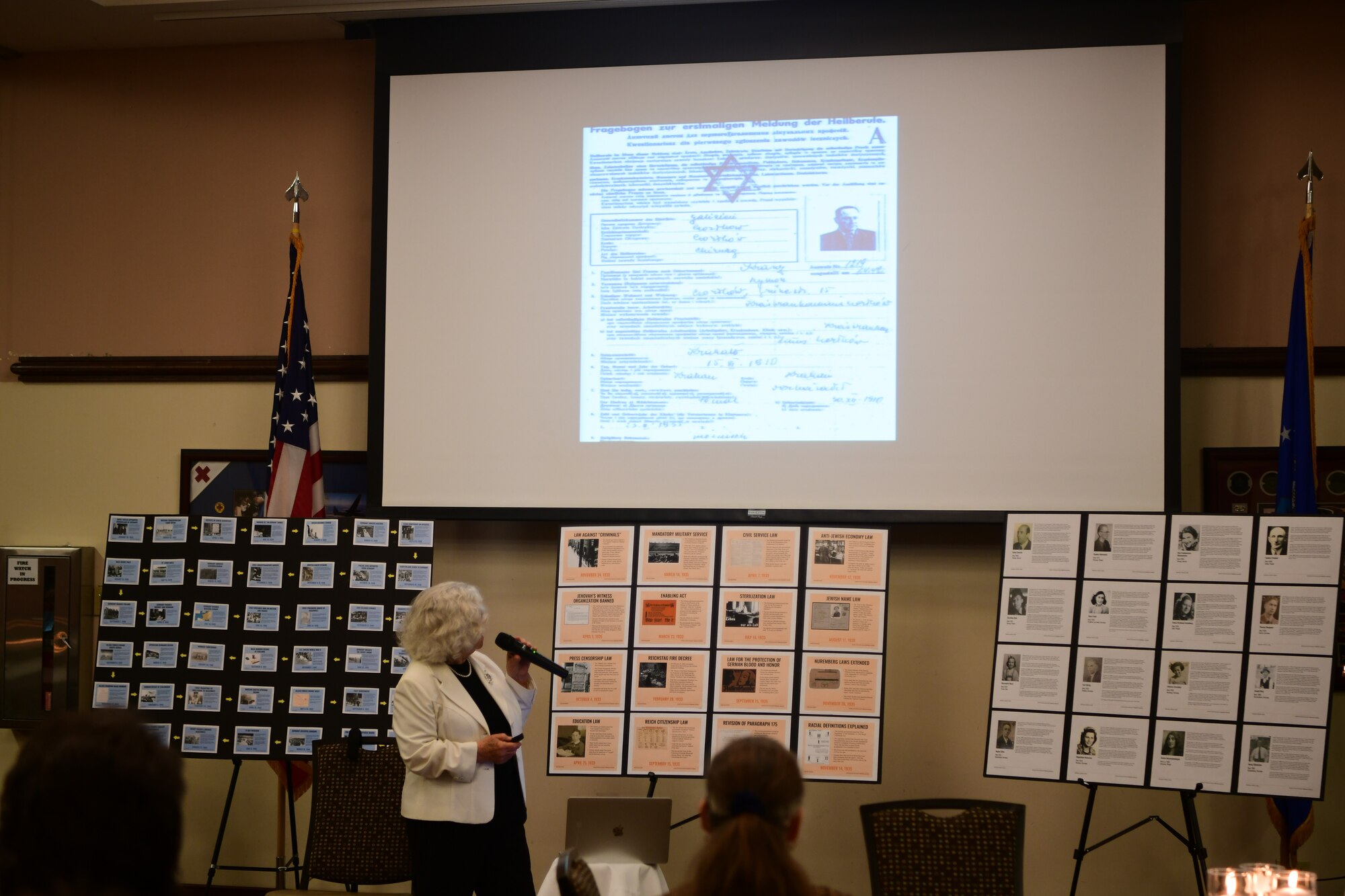 Elizabeth Igra, retired veteran educator, gives a speech at the Recce Point Club on Beale Air Force Base, California, on April 18, 2023.