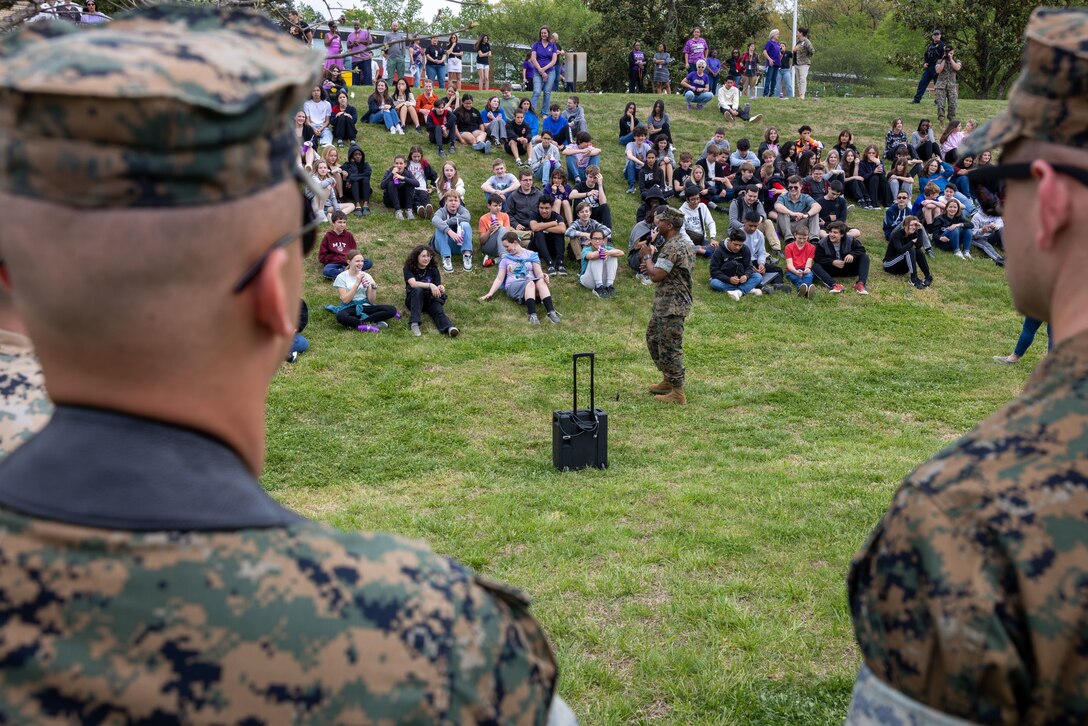 U.S. Marine Corps Col. Michael Brooks, base commander, and Sgt. Maj. Collin Barry, base sergeant major, both with Marine Corps Base Quantico, addresses students, thanking them for their contributions as members of a military family, during the Month of the Military Child at Quantico Middle High School, MCBQ, Virginia, April 14, 2023. April is designated as Month of the Military Child, which highlights the important role military children play in the Armed Forces community. (U.S. Marine Corps photo by Lance Cpl. Jeffery Stevens)