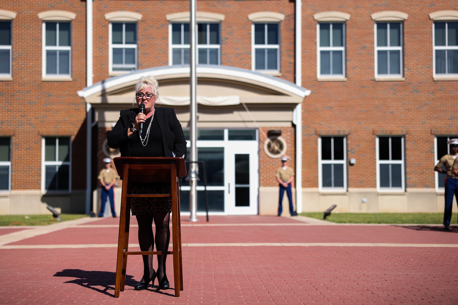 Teresa McMaugh, former U.S Marine Corps Cpl. Robert V. McMaugh’s sister, addresses attendees of the dedication and naming ceremony for McMaugh Hall on Marine Corps Base Quantico, April 18, 2023. This ceremony marks the 40th anniversary of the bombing of the U.S. Embassy in Beirut, in which McMaugh was killed in the explosion. (U.S. Marine Corps photo by Lance Cpl. David Brandes)