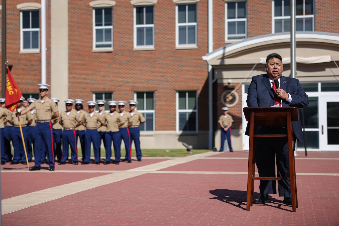 Retired U.S. Marine Corps Staff Sgt. Luis Lopez, a Marine Security Guard Watchstander who served with Cpl. Robert V. McMaugh at the U.S. Embassy in Beirut, addresses attendees of the dedication and naming ceremony for McMaugh Hall on Marine Corps Base Quantico, April 18, 2023. This ceremony marks the 40th anniversary of the bombing of the U.S. Embassy in Beirut, in which McMaugh was killed in the explosion. (U.S. Marine Corps photo by Lance Cpl. David Brandes)