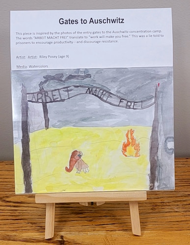 Inspired by the photos of the entry gates to Auschwitz concentration camp. The words “ARBEIT MACHT FREI” translate to “work will make you free.” This was a lie told to prisoners to encourage productivity—and discourage resistance. (Watercolor by Riley Posey)