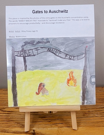 Inspired by the photos of the entry gates to Auschwitz concentration camp. The words “ARBEIT MACHT FREI” translate to “work will make you free.” This was a lie told to prisoners to encourage productivity—and discourage resistance. (Watercolor by Riley Posey)