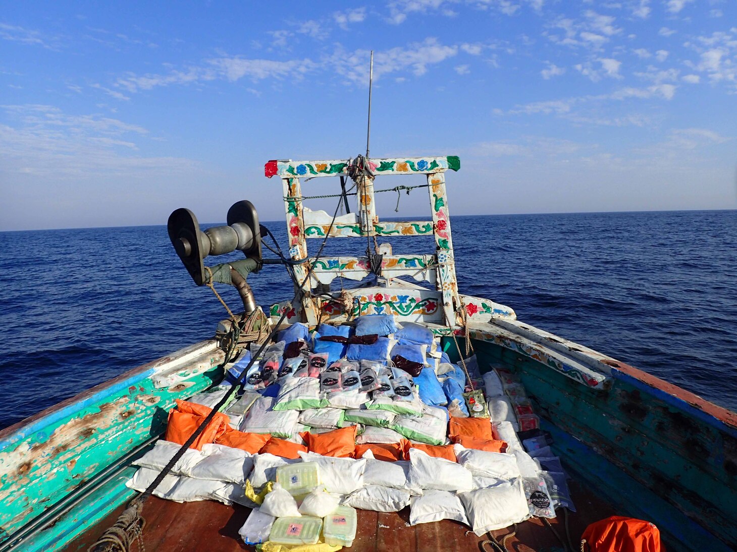 Bags of illegal narcotics are stacked for inventory aboard a fishing vessel seized by guided-missile destroyer USS Paul Hamilton (DDG 60) in the Gulf of Oman, April 21, 2023.