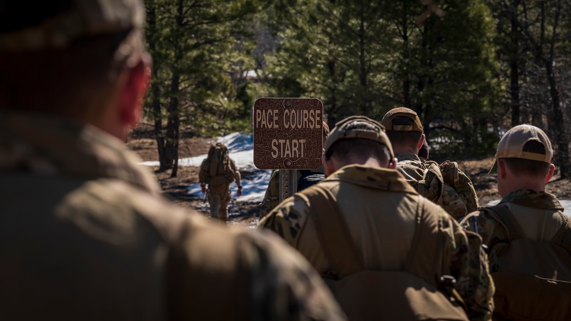 Members assigned to the 56th Civil Engineer Squadron Explosive Ordnance Disposal flight count how many steps it takes to complete 50 meters on a pace course at Camp Navajo, Arizona, April 11, 2023.