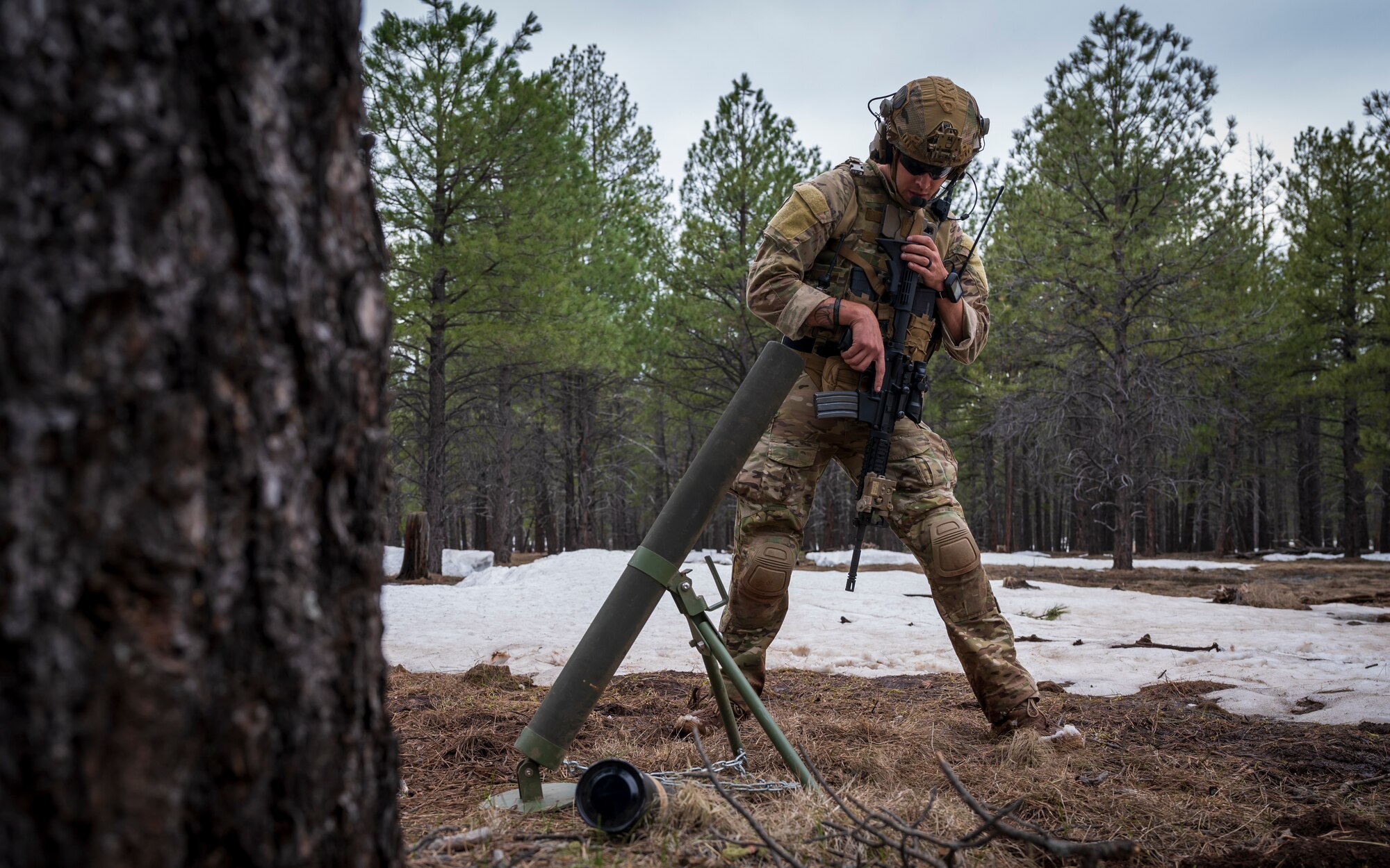 U.S. Air Force Tech. Sgt. Tyler Paul, 56th Civil Engineer Squadron Explosive Ordnance Disposal flight technician, investigates a mortar outside a mock village during a training scenario at Camp Navajo, Arizona, April 12, 2023.