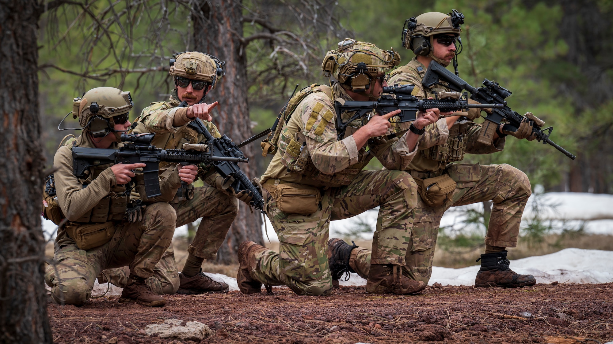 U.S. Air Force Master Sgt. Nikolas Kenna (center left), 56th Civil Engineer Squadron Explosive Ordnance Disposal flight technician, leads a group of Airmen assigned to the 56th CES EOD flight during a training scenario at Camp Navajo, Arizona, April 12, 2023.