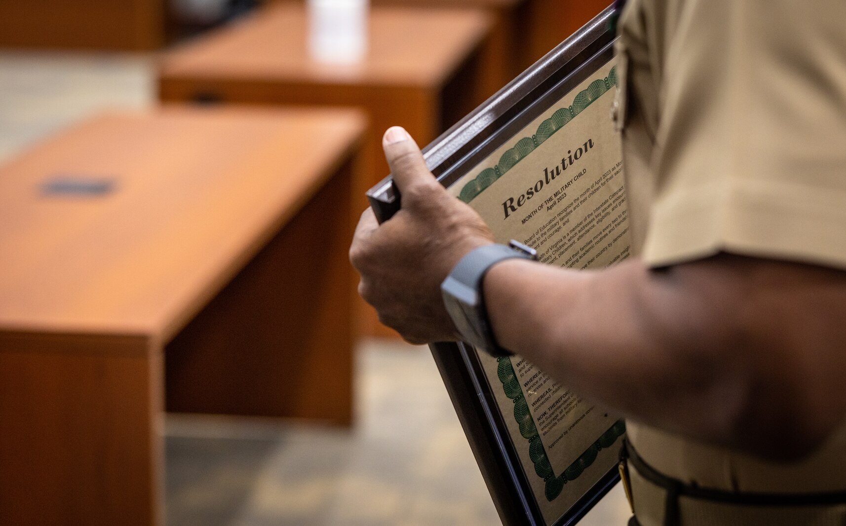 U.S. Marine Corps Col. Michael L. Brooks, base commander, Marine Corps Base Quantico, holds the proclamation during the Month of the Military Child Proclamation presentation at Edward L. Kelly Leadership Center, Manassas, Virginia, April 19, 2023. Brooks addressed the school boards of Prince William, Stafford and Fredericksburg to share his gratitude for the hard work each district has put into their “go purple” initiative to support military connected students. (U.S. Marine Corps photo by Lance Cpl. Joaquin Dela Torre)